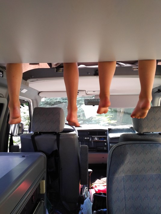 Kids' feet hanging in Van!